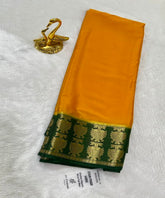 Premium Crepe silk with stain free Mustard Yellow with Bottle Green Border | Glow & Glitter Boutique
