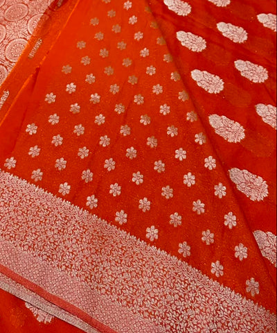 Banaras georgette silk sareeElegant Burnt Orange with Rich Silver Zari Border | Glow & Glitter Boutique