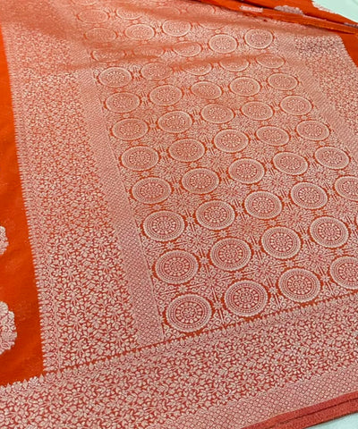 Banaras georgette silk sareeElegant Burnt Orange with Rich Silver Zari Border | Glow & Glitter Boutique